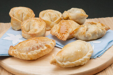 Assorted fried Italian appetizers on a cutting board