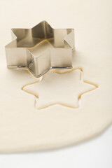 Star shape pastry cutter on dough