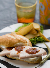 Close-up of a salami and salsa sandwich