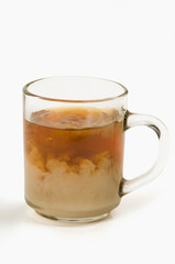 Close-up of a cup of tea on white background