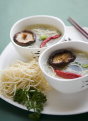 High angle view of Oriental mushroom soup with noodles