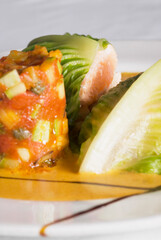 Close-up of fish steaks wrapped in cabbage leaves