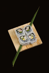 Close-up of uramaki sushi on a cutting board