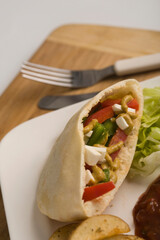 Close-up of a stuffed pita sandwich
