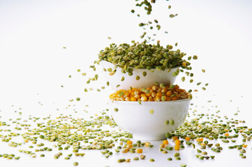 Close-up of bowls of green lentils and corn kernels