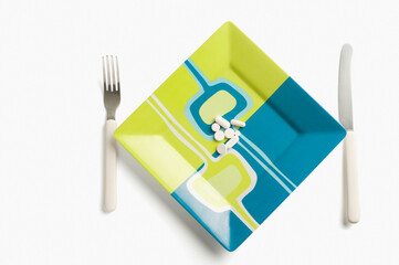 Close-up of vitamin pills on a plate