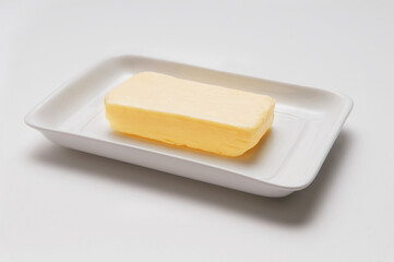 Close-up of butter on a white tray
