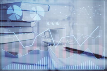 Double exposure of financial chart drawing and desktop with coffee and items on table background. Concept of forex market trading