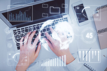 Double exposure of woman hands working on computer and forex chart hologram drawing. Top View. Financial analysis concept.