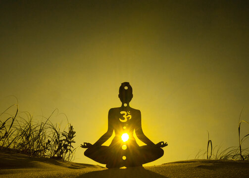 yoga position silhouette in contrasting sun, Solar Plexus chakra