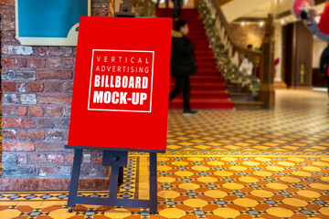Mock up blank vertical signboard on black stand at hall