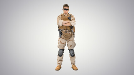 Private military contractor with crossed arms on gradient backgr