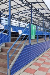 empty grandstand for visitors at the sports stadium with seats