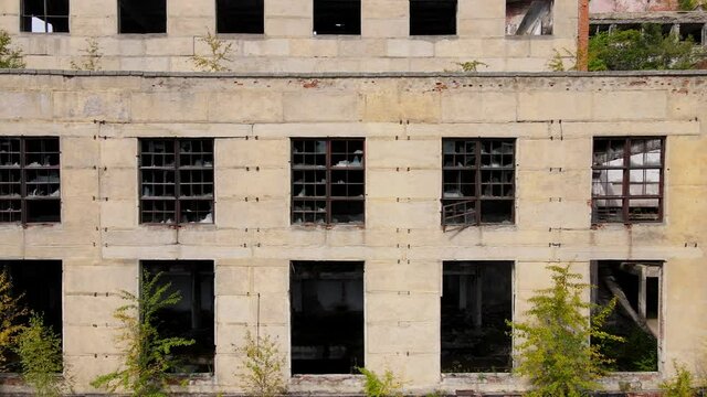 View from above. The camera flies past the abandoned plant of the Khrustalnensky mining and processing plant in the village of Khrustalny, Primorsky Territory. Abandoned tin mining plant