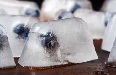 ice cubes on wooden floor selective focus