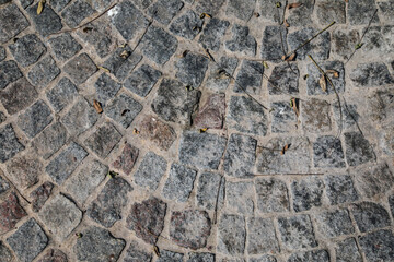 Construction materials. Paving stone. Closeup view of the cobbles of the driveway. 