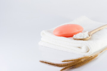 A bar of soap and a clean white towel