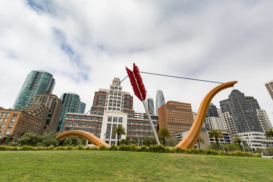 SAN FRANCISCO, USA - JULY 18 2017: Cupid's Span statue by famous artists Claes Oldenburg and Coosje van Bruggen in Rincon Park with the city as a backdrop