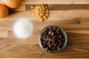 Baking Chocolate Chip Cookies with Sugars on Walnut Butcher Block
