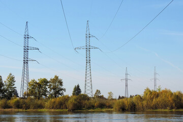   High Power Transmission Lines and summer landscape , river and meadow        