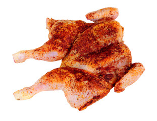 Raw spatchcock chicken with piri piri seasoning isolated on a white background