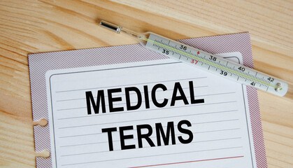 On a sheet from the diary is the inscription MEDICAL TERMS. Nearby is a thermometer, a medical concept.