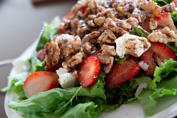 Strawberries and walnuts on a salad