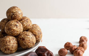 Homemade energy truffle balls. Raw vegan healthy dessert, date and nuts balls, ingredients.