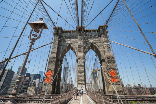 NEW YORK - JULY 20: Views of the Brooklyn Bridge on a summer day on July 20, 2016. Its a famous and iconic bridge in New York, which passes the east river.