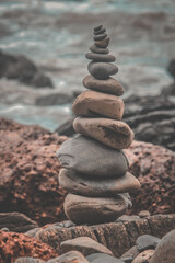 stack of stones, stones on the beach, stack of stones on beach, prayer by Carol Ann Duffy, summary and analysis, land art by human, the building way of life to deal with an epidemic of coronavirus's