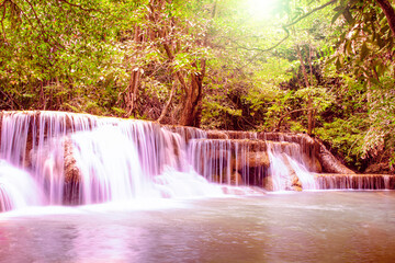 Huay Mae Khamin Waterfalls, Srinakarin Dam National Park, Si Sawat District, Kanchanaburi, Thailand, Beautiful landscape of waterfall with sunset light in dark forest