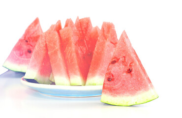 Pieces of juicy ripe sweet natural watermelon on white. Useful vitamins in summer. Seasonal fruits and berries.