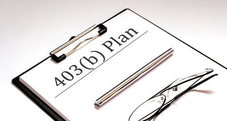 Document with sign 403b plan with pen and glasses .Retirement concept.