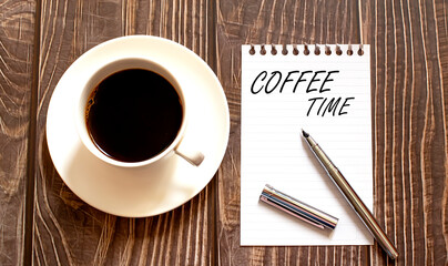 COFFEE TIME - white paper with pen and coffee on wooden background