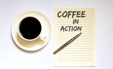 COFFEE IN ACTION - white paper with pen and coffee on wooden background