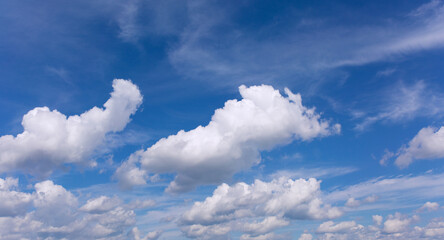 White clouds on blue sky background.