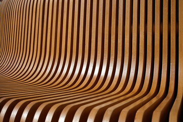 beautiful texture of curved lacquered wood slats as background