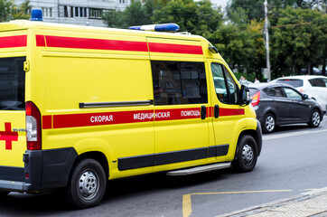 Fototapeta na wymiar Ambulance in a traffic jam on a city street. Movement. Emergency medical care. The resuscitation machine. Russia. Krasnoyarsk. September 18, 2020.