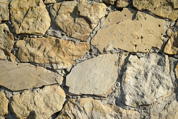 beautiful wall texture of natural natural stone of different sizes as background