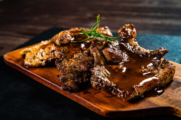 Barbecue pork neck with apples on wooden board