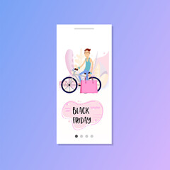 Black friday - man on a bike, bought shopping at a sale