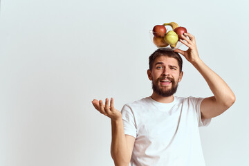 Naklejka premium man with fresh fruit in a glass cup gesturing with hands vitamins health energy model bushy beard mustache