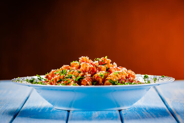 Fusilli with tomato sauce, meat and parmesan on wooden table
