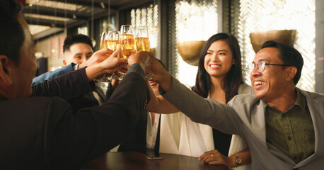 businesspeople toasting and clinking wine or champagne together