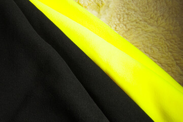 Yellow abd black fleece, soft napped insulating fabric