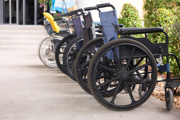 Fototapeta na wymiar Many wheelchair orderly ready to service on hospital