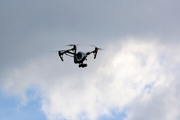 Fototapeta na wymiar Drone flying in a cloudy sky 