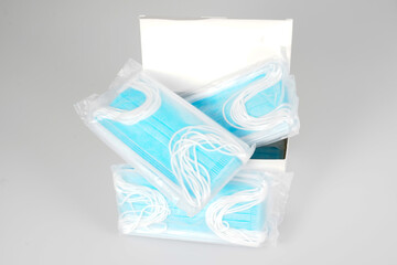 Blue medical face mask in white box