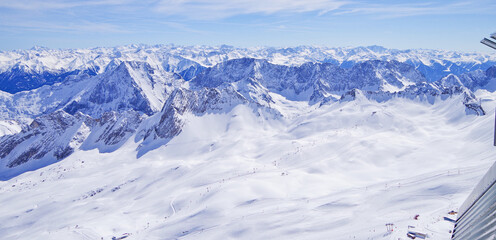 Panoramic landscape and scenic view over Alpine mountains and mountain range from Zugspitze summit...