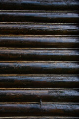 wooden beams at a cottage isolated with rope in Romania,Bistrita